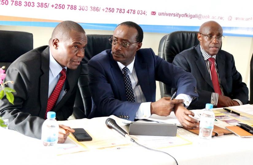 Prof. Nshuti (C) chats with Vice-Chancellor Siraje Kaaya (L), as Afrika looks on during the media briefing yesterday. (Courtesy)