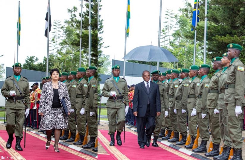 The new Egyptian ambassador to Rwanda, Namira Nabil Mohammed (L), and Ali Idi Siwa, the envoy for Tanzania, inspect a guard of honour mounted by the Presidential Guard at Village Urugwiro in Kigali yesterday. (Village Urugwiro)