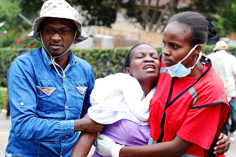 A survivor is helped to safety by Red Cross members. (Net)