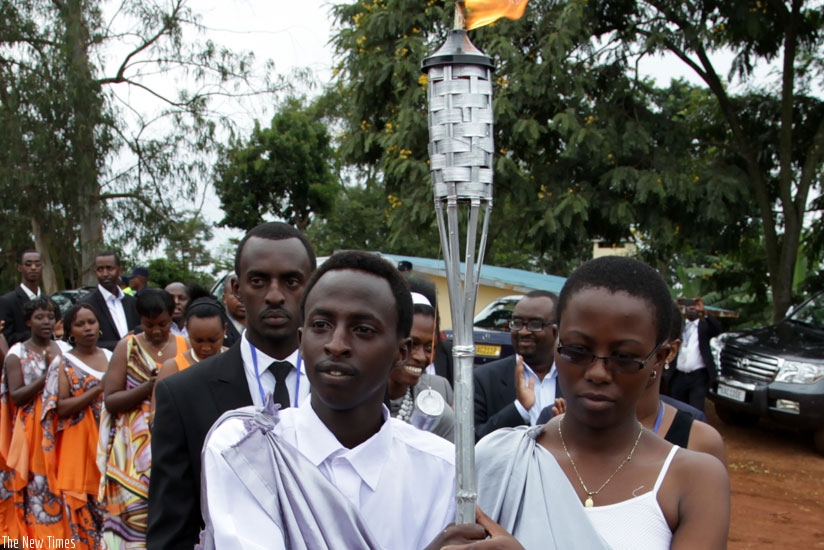 Youth carry the commemoration flame in Kicukiro District on its last leg of a countrywide tour last year.