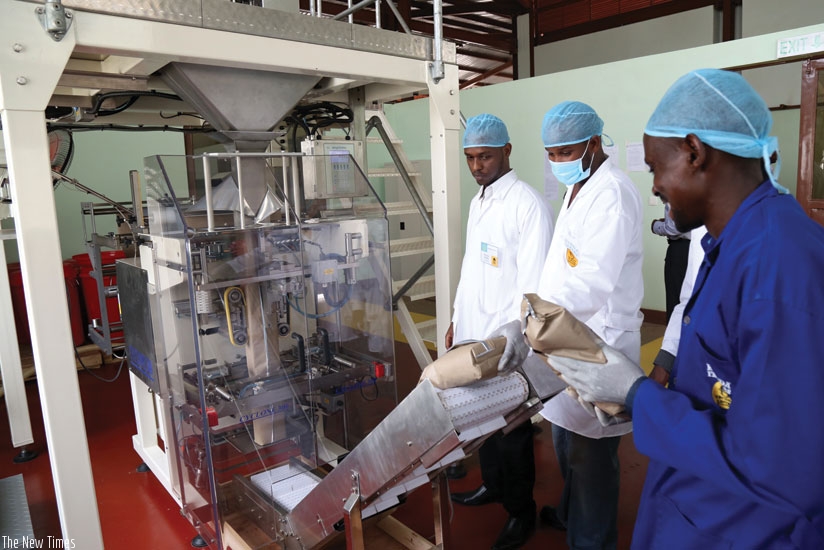 Workers at the packaging section of a coffee factory in Kigali. Poor packaging is affecting local producers. (John Mbanda)
