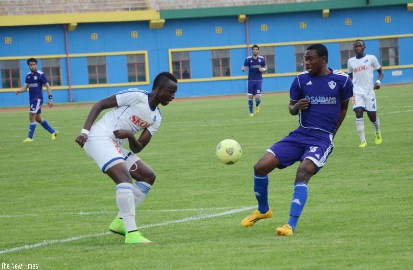 Rayon Sports defender Faustin Usengimana (L) tries to stop Zamalek's Maroof Yusuf during yesterday's CAF Confederations Cup tie. The blues were eliminated after losing 3-0. rn(Sam Ngendahimana)