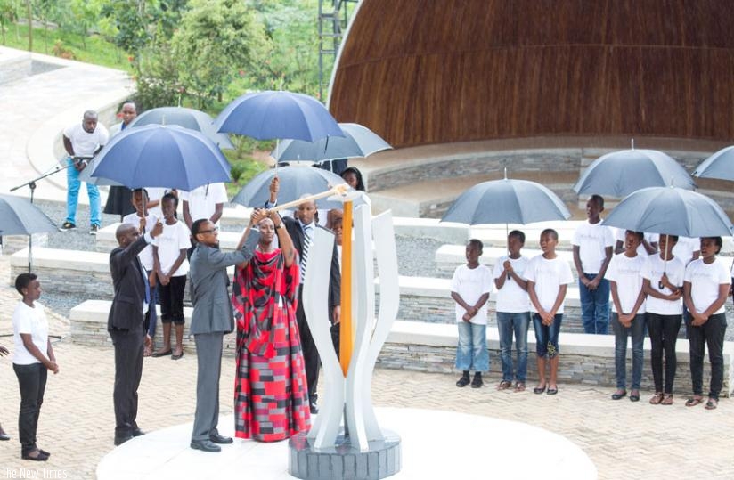 President Kagame and First Lady Jeannette Kagame light the Flame of Hope at Kigali Genocide Memorial Centre, Gisozi, yesterday. (Village Urugwiro)