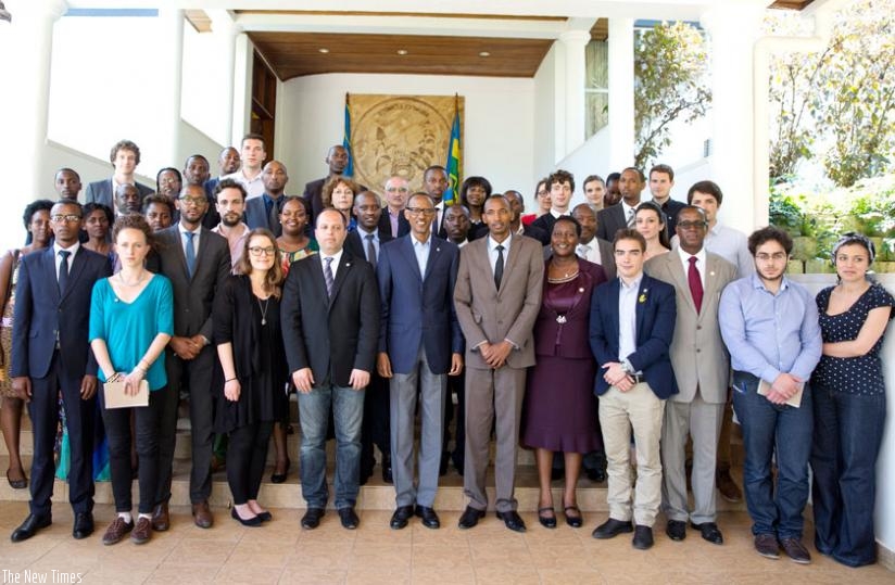 President Paul Kagame in a group photo with members of European and Rwandan civil society working toward raising awareness and justice to issues of genocide across the world after a meeting at Village Urugwiro, yesterday. (Village Urugwiro)