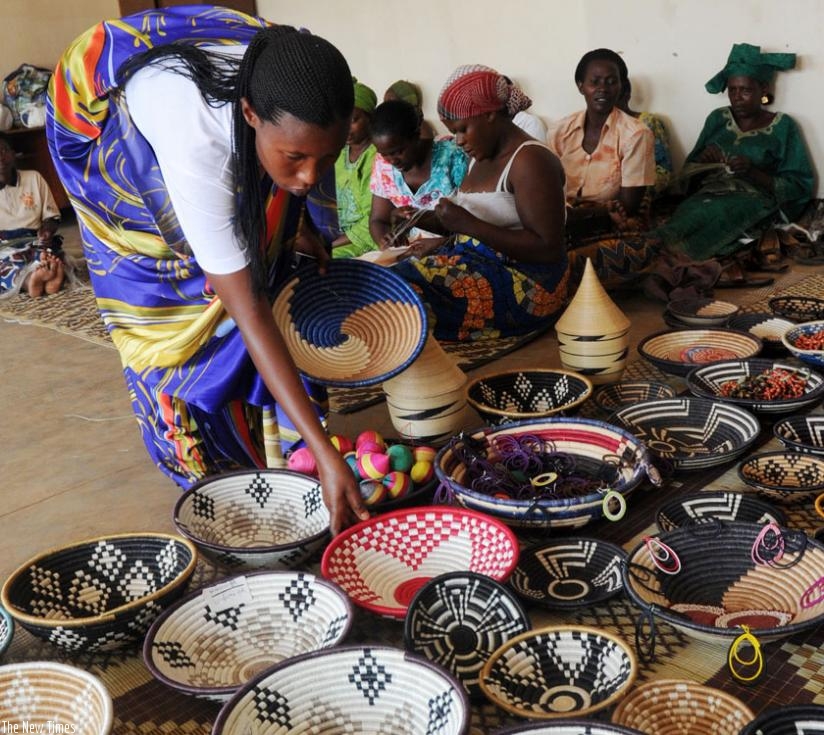 Women weaving baskets in Gatsata, a Kigali suburb. (John Mbanda)