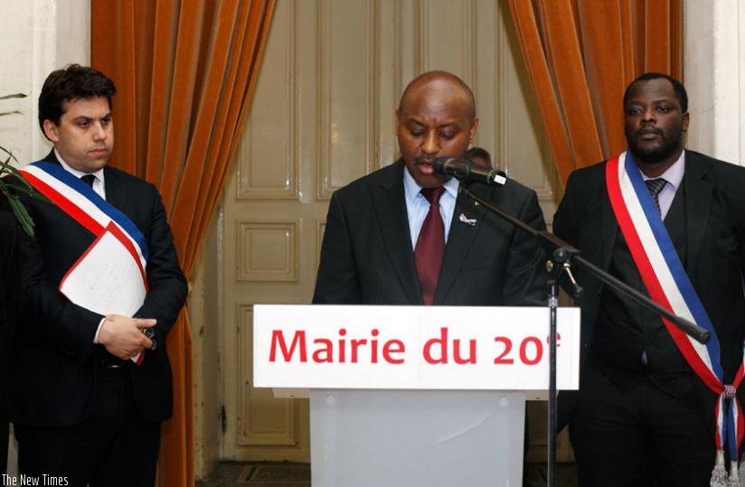 Amb. Kabale (centre) addresses mourners during the commemoration event in France on Tuesday. (Courtesy)