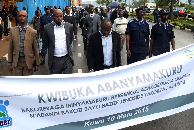 Members of the media fraternity and members of Police media relations department during a walk in remembrance of journalists who lost their lives to the 1994 Genocide against Tutsi in Kigali, yesterday. (John Mbanda)