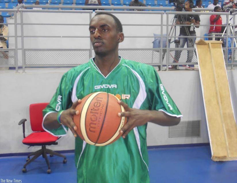 Aristide Mugabe prepares to take a shot during a training session. The 27 year old credits basketball for helping him cope with the trauma of genocide. (File)
