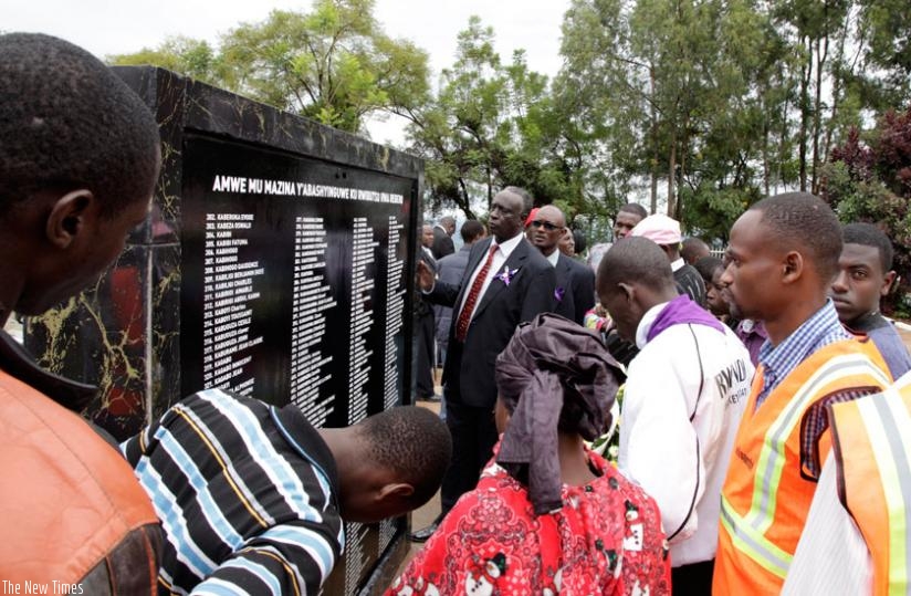 Relatives of the victims of 1994 Genocide peruse through the names at Rebero last year. (File)