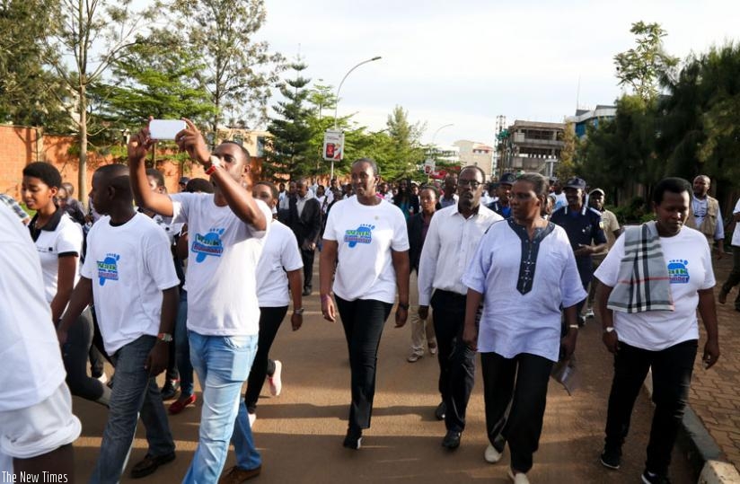 First Lady Jeannette Kagame (centre) with government officials and youths participate in a Walk to Remember yesterday.(Timothy Kisambira)