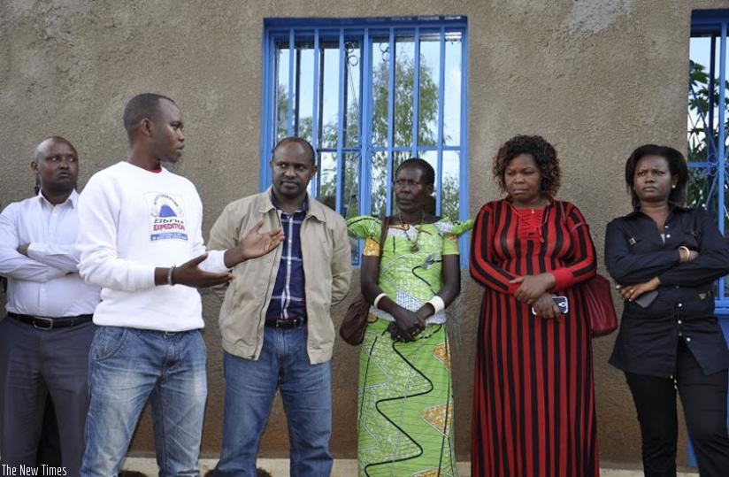 Rubyiruko (left), principle Gatabazi (2nd left),Iyakaremye (2nd right) and vice- mayor Niwemwiza after the handover of the houses in Rulindo on Saturday. (Solomon Asaba)