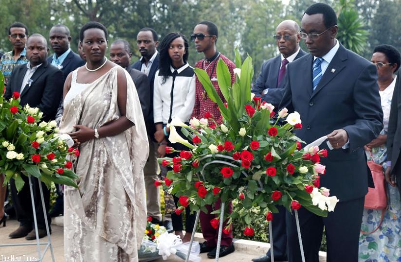 Senate President Bernard Makuza (R) lays a wreath as Sports and Culture minister Julienne Uwacu looks on after laying one too, at Rebero Genocide Memorial Centre in Kicukiro. (John Mbanda)
