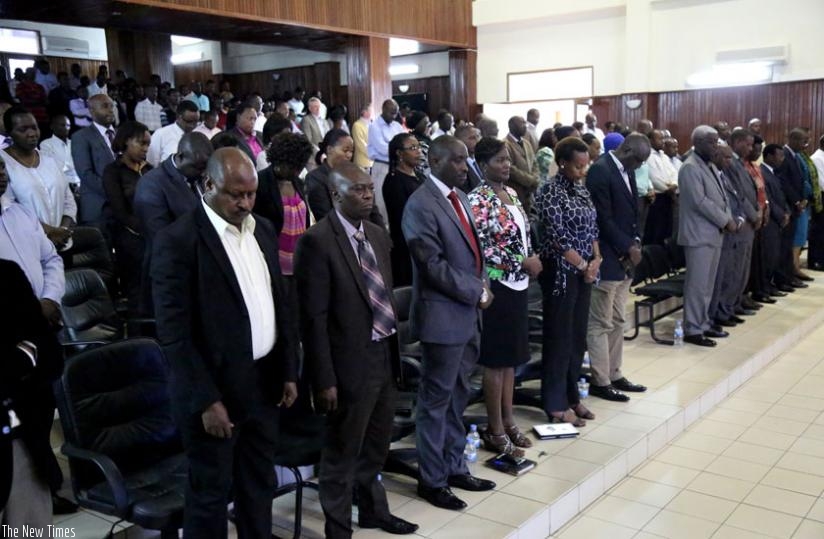 Members of the Judiciary  observe a minute of silence in honour of  the 1994 Genocide victims yesterday. (John Mbanda)