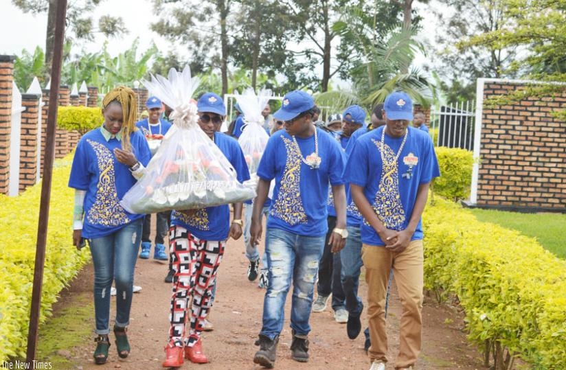 Artistes led by Dream Boys' Platini arrive at the memorial site.