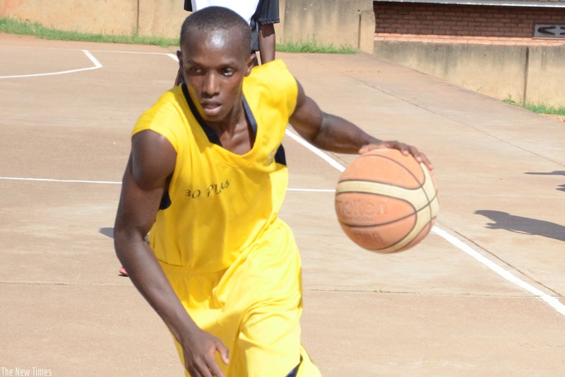 A 30-Plus  Point Guard in action during a previous league game. 30 plus take on IPRC-Kigali at Amahoro indoor stadium. (Sam Ngendahimana)