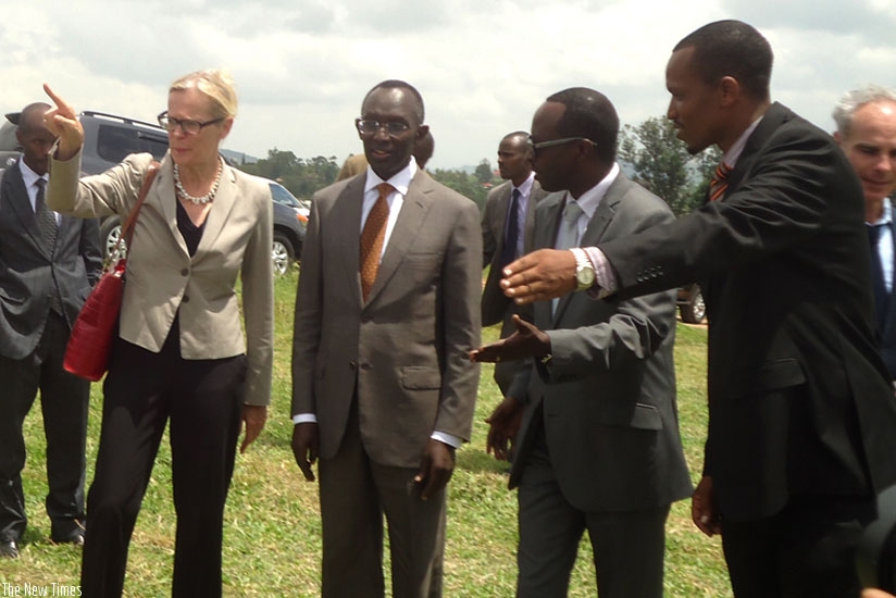Amb. Cuelenaere (L) and Prof Rugege  (2nd left) are showed to the site of the court premises in Nyanza Distict yesterday. (Courtesy)