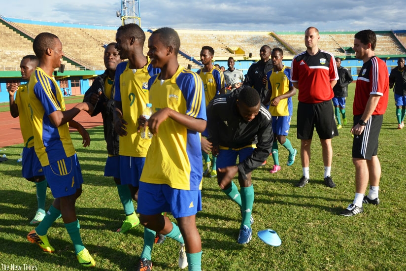 McKinstry (R) oversees his youthful team during his first training session at Amahoro Stadium ahead of the friendly with Zambia, which Rwanda lost 2-0.