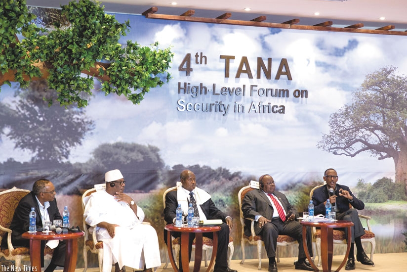 President Paul Kagame (R) speaks during the panel session at the meeting yesterday. (Village Urugwiro)