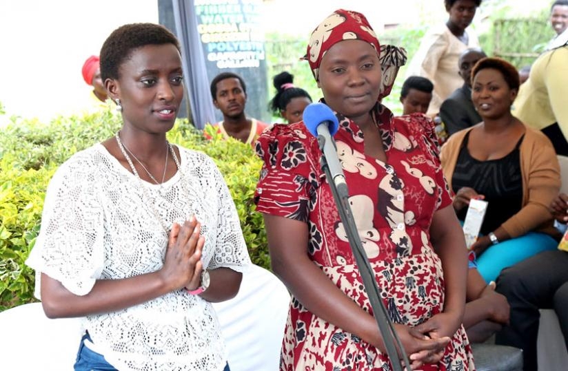 A humbled Uwase (L) being introduced by Uwamahoro during the function last week. (John Mbanda)