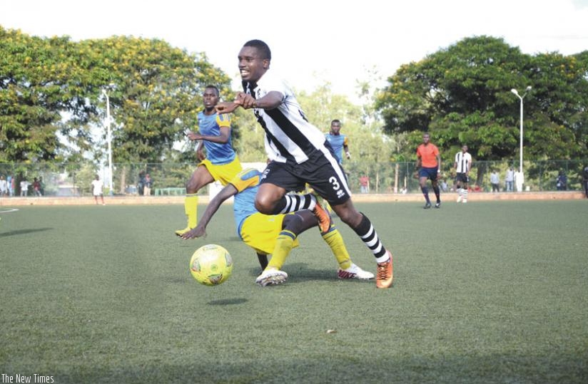 APR right back Albert Ngabo goes past Amagaju defender during the army side's 2-0 win yesterday. APR need two more wins and a draw to retain the league title. (Sam Ngendahimana)