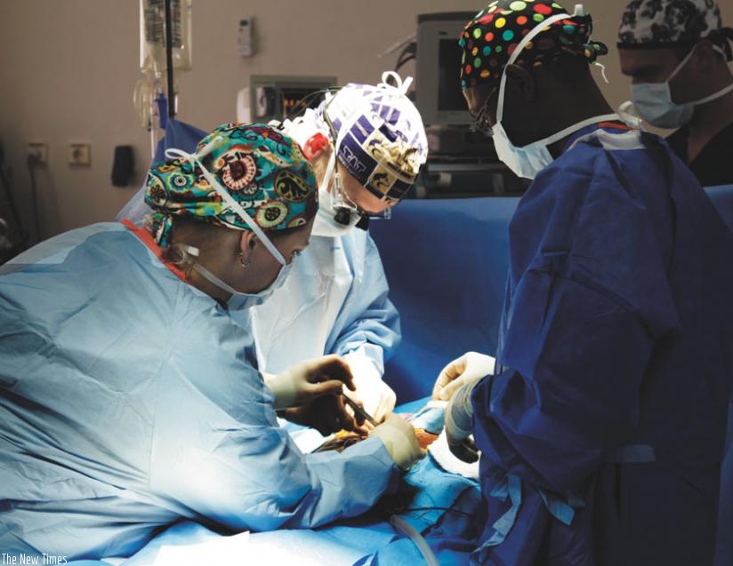 A team of surgeons carry out an operation. EAC needs strategies that meet its development needs. (File)