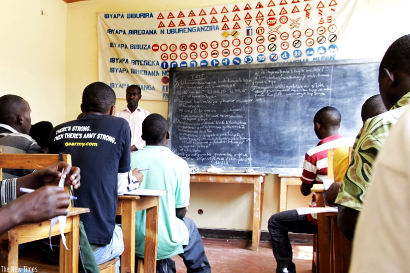 Learners undergo instruction on the highway code at a driving school in Kigali. (File)