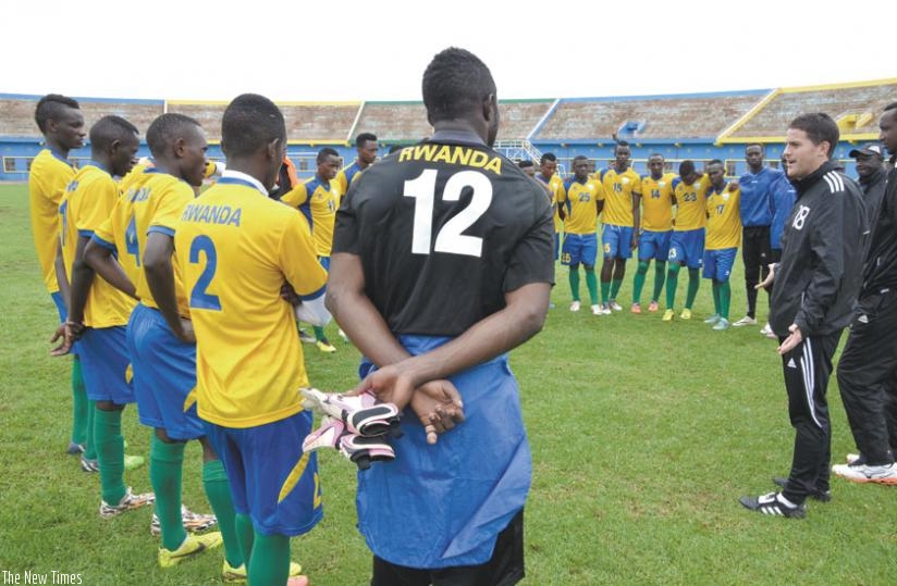 Amavubi Coach Johnny Mckinstry talks to the players after training yesterday. The Irish coach says Cecafa Challenge cup will provide the ideal preparation for the national team ahead of the CHAN tournament next year. (Sam Ngendahimana)