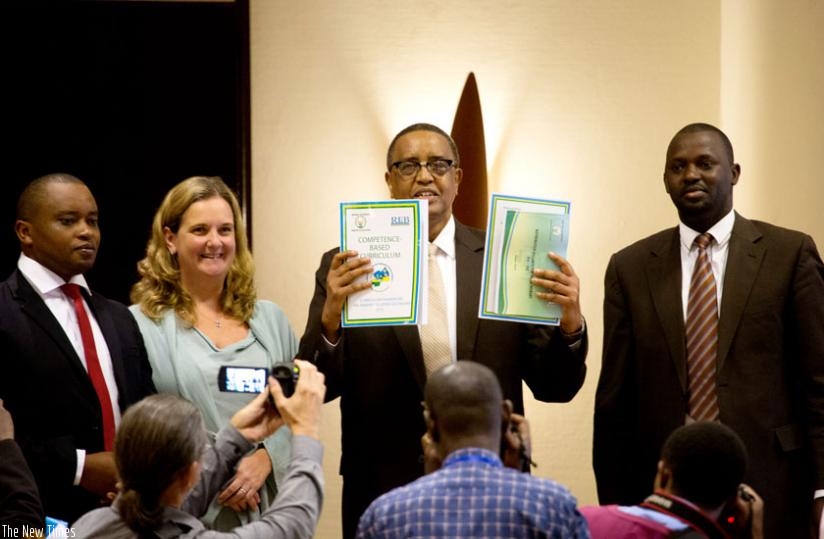Education minister Silas Lwakabamba (C) unveils the new schools curriculum as State Minister for Primary and Secondary Education Olivier Rwamukwaya (L), Noala Skinner, UNICEF country representative (2nd left), and the Director-General of Rwanda Education Board, Janvier Gasana, look on in Kigali yesterday.(Timothy Kisambira)