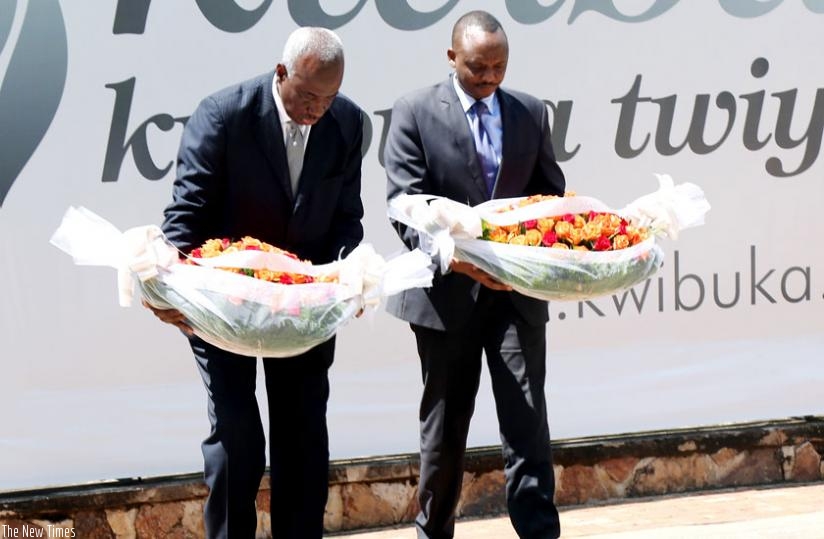 ICTR Chief Prosecutor Hassan Bubacar Jallow (L) and Prosecutor-General Richard Muhumuza pay tribute to Genocide victims at Kigali Genocide Memorial Centre, Gisozi, yesterday. (John Mbanda)
