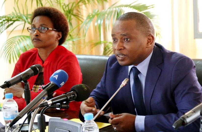 Rwamukwaya  addresses the media as Musabe looks. (John Mbanda)