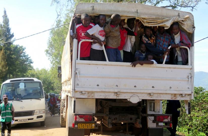 Some of the Burundian refugees are taken to Muyira Sector to register prior to being relocated to Kirehe. (Emmanuel Ntirenganya)