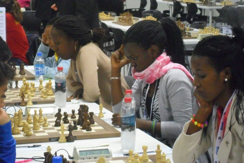Shimwa (2nd from left) and teammates at the 2014 Chess Olympiad last August. The Rwandan female team at the time included 11-year old Layola Murara Umuhoza (far left). (Courtesy)