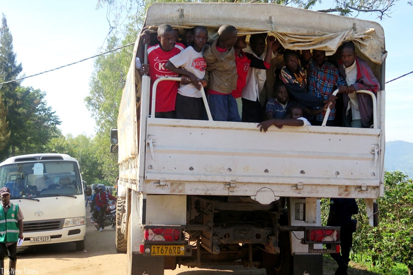 Some Burundian refugees being transported to Muyira Sector to get registered prior to being given proof of registration for asylum seekers, after which they can relocate. (Emmanuel Ntirenganya)