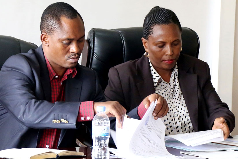 Sano (L) with WASAC Director of Support Services Marie-Josu00e9e Mukanyamwasa before the MPs yesterday. (John Mbanda)