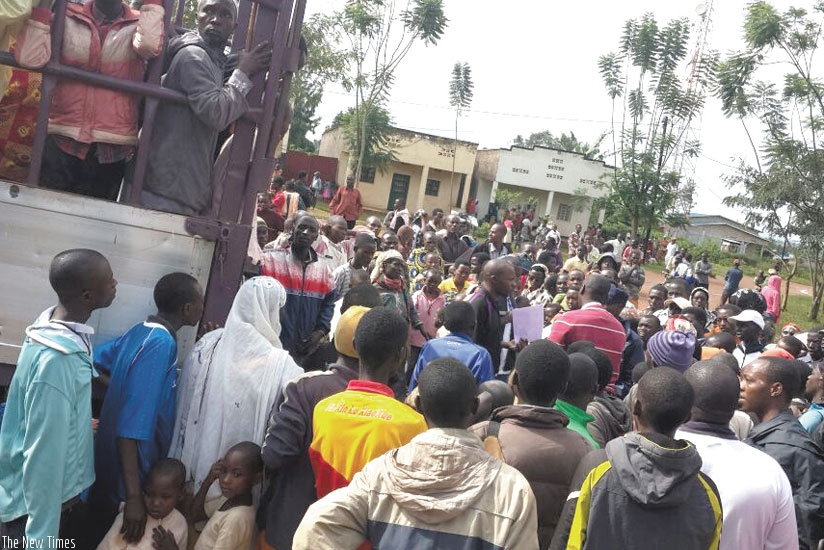 Burundian refugees at Nyamabuye Sector in Bugesera District board a truck to Gashora yesterday morning. (Courtesy)