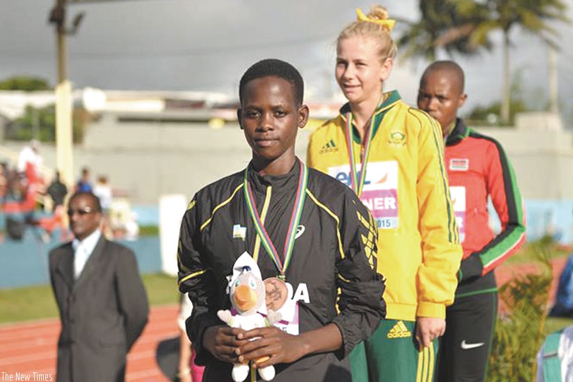Honorine Iribagiza on the podium with the bronze medal that she won in the 800m. (Courtesy)