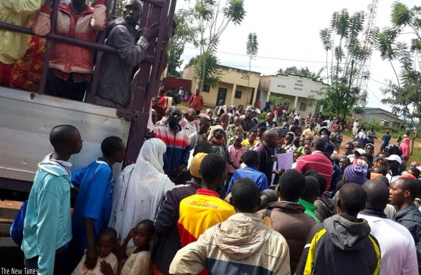 Burundian refugees at Nyamabuye Sector in Bugesera District board a truck to Gashora at the weekend. (Courtesy)