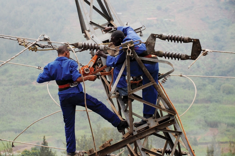 Workmen fix a powerline. Manufacturers are looking for answers to electricity and water supply challenges. (File)