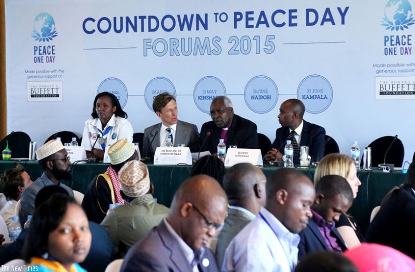 Panellists L-R; Ange Kamugisha, programme manager of Rwanda Girl Guides Association; Jeremy Gilley, chief executive of Peace One Day; Rev. Onesphore Rwaje of Peace Plan; and Seleman Nizeyimana, founder of Association for Youth Literacy and Traders Education, discuss the significance of concerted efforts in promoting peace and development. (John Mbanda)