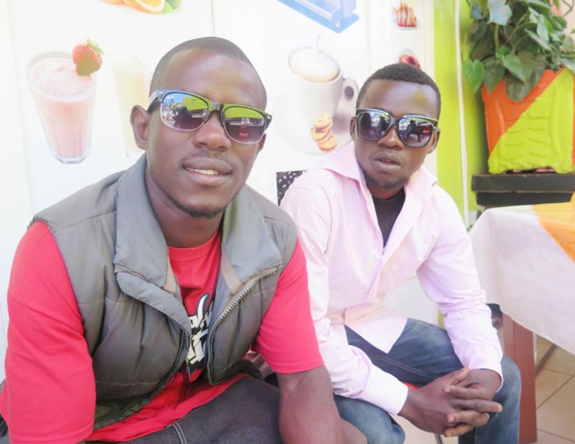 Samuel Niyogakiza (L) and Elie Nsengimana did not let the hardships of living on the street come in the way of their dream to rap. (M. Opobo)