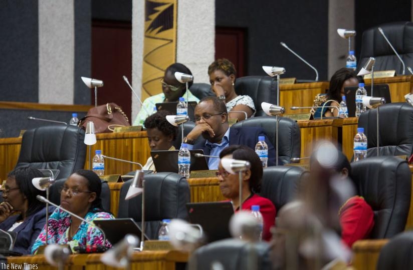 Members of Parliament listen to Minister Gatete yesterday. (Timothy Kisambira)