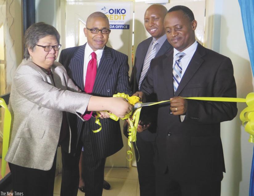 Ledesma (left) and Muhimuzi (right) are joined by other officials at the launch of the firm's new head offices in Kimihurura, Kigali on Tuesday. (Peterson Tumwebaze)