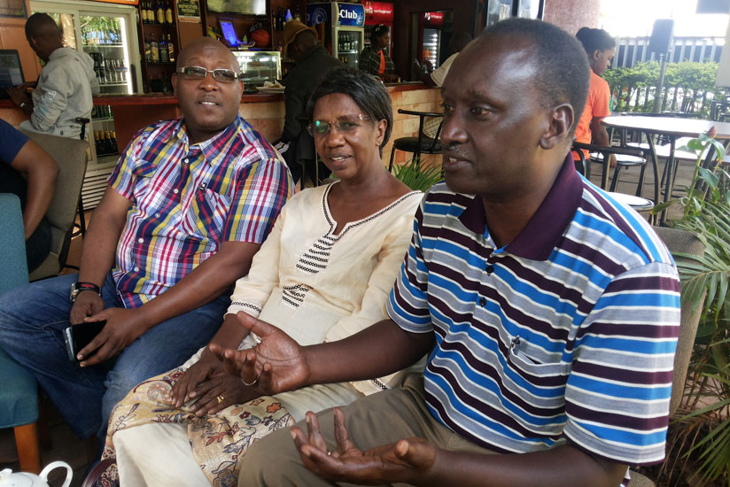 Bishop Birindabagabo (R), Mrs Edith Ariko, the vice chairperson of the fundraising team (C) and Isaac Rucibigango at the final preparatory meeting yesterday.