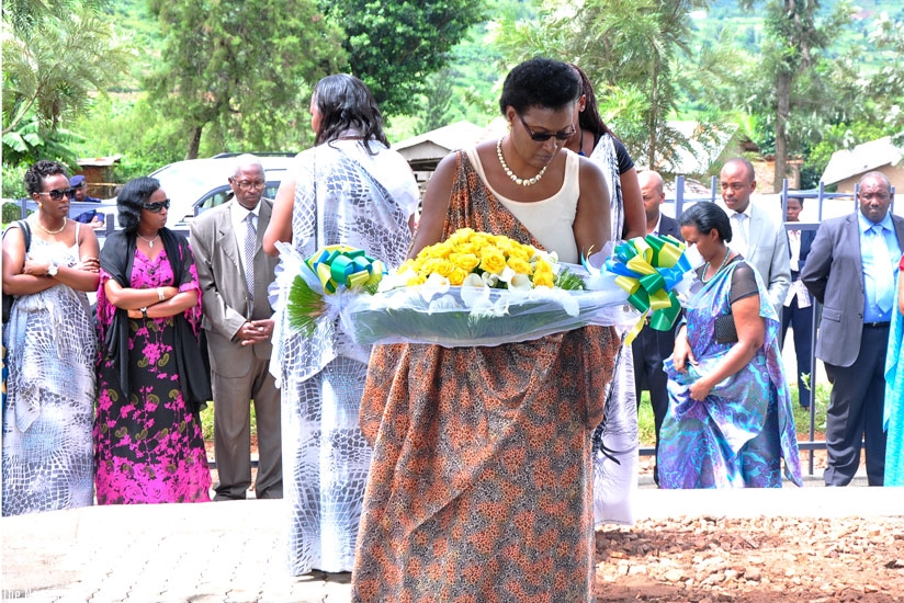 Speaker of Parliament Donatille Mukabalisa lays a wreath in memory of over 350 women and children killed during the 1994 Genocide against the Tutsi at Bambiro Mountain in Kibilizi Sector, Nyanza District (Courtesy)