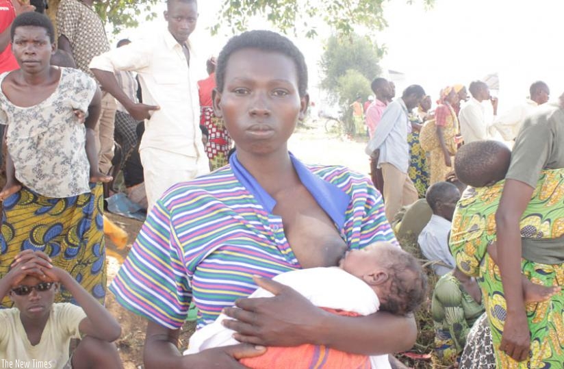 Baby Diera Mahama Irankunda, born April 23, breast feed afar days after her mother, Jeanine Minani, and thousands of other Burundian refugees arrived at Mahama refugee camp in Kirehe District.   (Kenneth Agutamba)