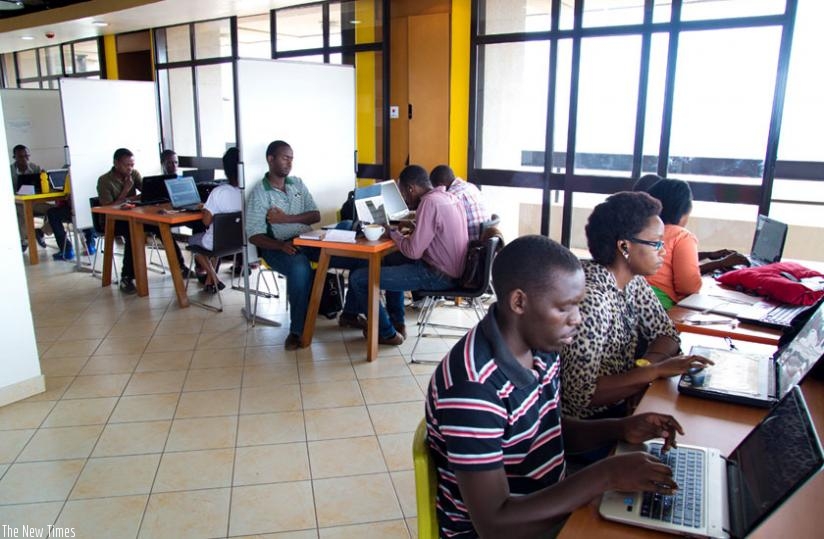 Software developers at K-Lab. The techs have been urged to be wary of cyber crime trends. (Timothy Kisambira)