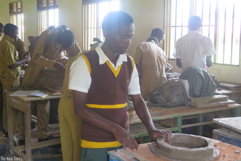 A student moulds an object from clay. The partnership will boost vocational education. (Solomon Asaba)