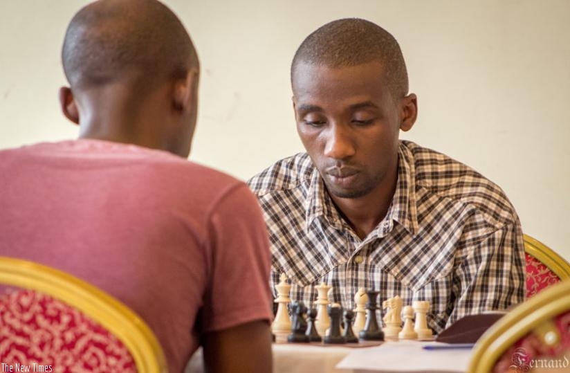 Rukimbira (R) lost to Vision Chess Club's Ivan Mugisha during last week's Rwanda Chess Open. But his recent show at the Zone 4.2 Chess Championships in Kampala takes Rwanda higher in world ranking. (Fernand Mugisha)