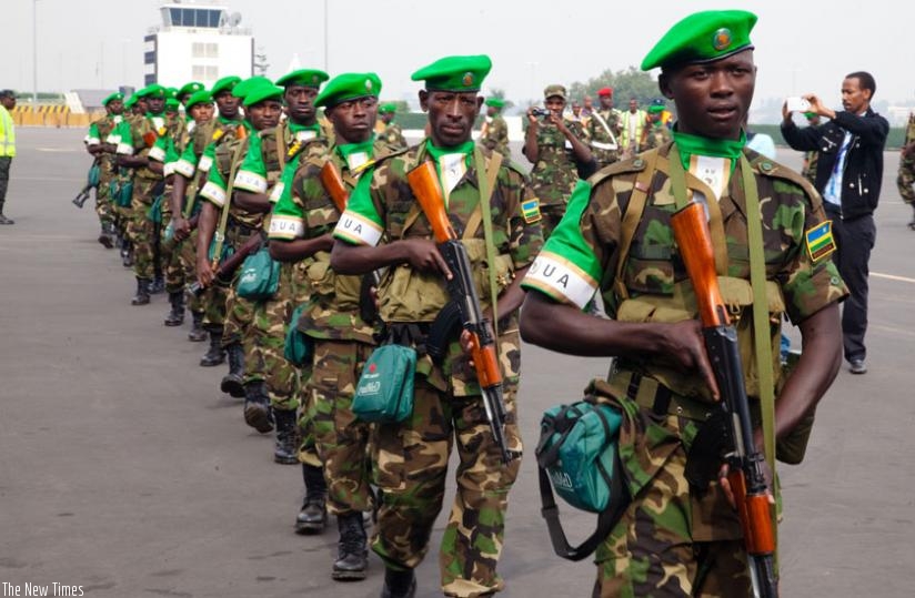 Rwandan troops in a single file before boarding a plane en route to Central Africa for a peace-keeping mission in the past. (File)