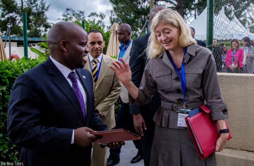 Minister Nsengimana (L) chats with the US Ambassador to Rwanda , Erica Barks-Ruggles, at the launch of the forum in Kigali yesterday. (Timothy Kisambira)
